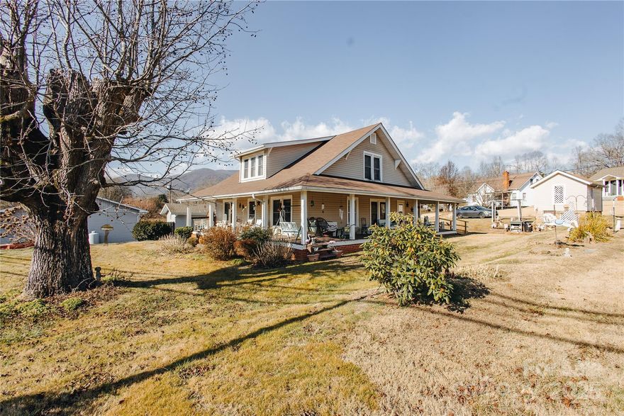 Charming Historic 1929 Farm-Style Home in Desirable Pleasant Gardens
Step back in time with this beautiful 1.5-story farm-style home built in 1929—one of the oldest and most character-rich properties in the sought-after Pleasant Gardens community. Gracefully set along historic US Highway 70 (once a stagecoach route with a stop directly across the road), this timeless residence offers a rare blend of vintage charm and convenient modern access. The inviting wrap-around porch spans three full sides of the house, providing generous outdoor living space perfect for rocking chairs, morning coffee, or watching the world go by while enjoying peaceful rural views. Inside, the main level features a cozy living room, country kitchen, convenient laundry room, and utility room—along with 2 bedrooms and 1 full bathroom for comfortable one-level living if desired. Upstairs, the second floor offers 3 additional bedrooms and another full bathroom, ideal for family, guests, or flexible use as offices or hobby rooms. Located in the heart of Pleasant Gardens, this historic gem predates most homes in the area and exudes the authentic character of early 20th-century mountain living—all while being less than an hour from the vibrant culture, dining, and amenities of downtown Asheville. Whether you're seeking a primary residence steeped in history, a weekend retreat, or a restoration project with incredible potential, this 1929 treasure is a rare find. Don’t miss your chance to own a piece of McDowell County heritage.