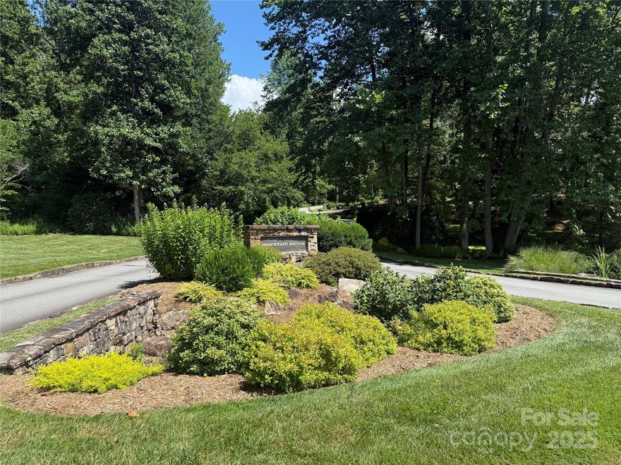 Exceptional 1.03 acre level buildable lot in the tranquil Mountain Brook subdivision of Brevard. This easily accessible lot offers the perfect blend of natural beauty, convenience, and exclusivity that speaks to your soul while eliminating otherwise costly site preparation, making it ideal for creating your custom mountain retreat. Utilities are  underground. Just 2.5 miles from downtown Brevard, Mountain Brook offers the serenity of mountain living while maintaining easy access to urban amenities including Brevard Health and Racquet Club just up the road. Mountain Brook is one of Brevard's finest residential communities featuring lush landscape and quality mountain style homes.