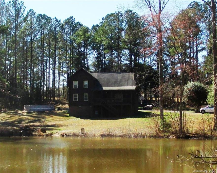Want a private country setting, acreage, pond and a home with a rustic feel?  This is your home!  Gorgeous Log Cabin Home located on 3 acres with pond (shared pond), approximately 1728 Sq Ft, 2 car attached garage, new windows, HVAC replaced recently.  Master bedroom on first level, loft and 2 bedrooms on 2nd level.  Large Great room w/ large window over looking pond, Large Laundry room w/ desk and space for a freezer. NO HOA!  Don't wait!  This one won't last long!