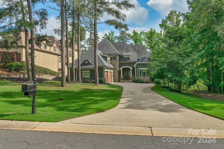 Must see waterfront home located in the Gated Community of Reflection Pointe! The house sits on a level lot with a beachfront, views of Lake Wylie, and a deeded 30' boat slip/boat lift. The main level has an open floor plan with hardwood floors throughout. The kitchen boasts quartzite countertops, tile backsplash, Thermador appliances, self-closing cabinets, and a large center island. Unique Butler's kitchen is great for entertaining and serving buffet style. Attention to detail throughout with coffered ceilings, custom molding, recessed lighting, and ceiling speakers. Two stone fireplaces, natural gas, and wood burning. Enjoy relaxing with a good book in the den/library. Primary with tray ceilings & beautiful lake views, a garden tub, marble floor, countertops, steam shower, and walk-in closets.  Bedrooms 2 & 3 have full baths and workout/bonus rm. Enjoy the expansive outdoor living space with a covered porch with retractable wall screens, Hydro-pool, stone fireplace & grilling area.