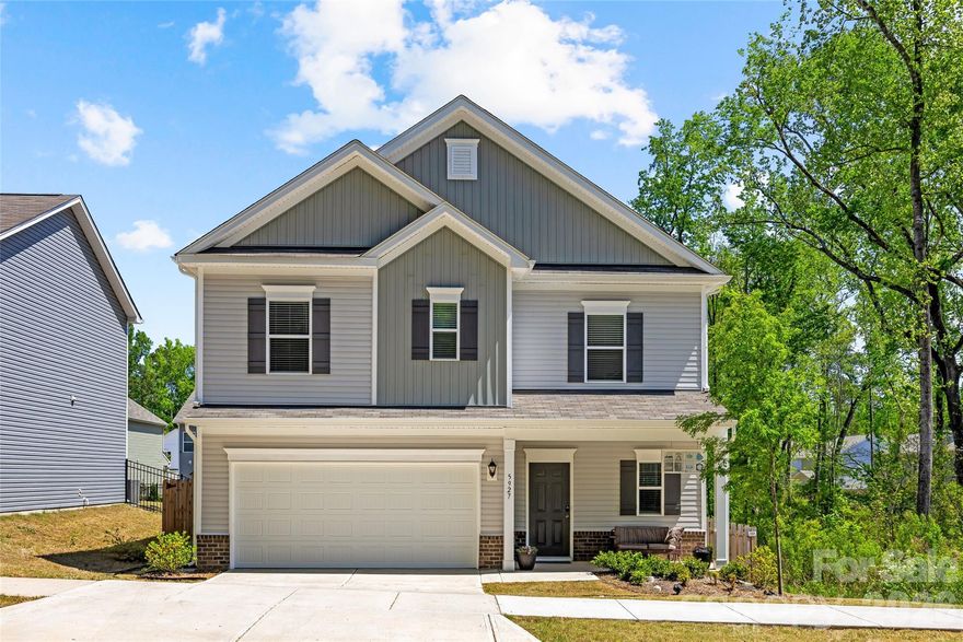 Built in 2024 and truly move-in ready, this stunning home offers a functional layout in a great location — just minutes from Plaza Midwood, Uptown, and SouthPark. A welcoming foyer opens to a bright, open main living area where the living room, dining space, and well-appointed kitchen connect seamlessly. The kitchen impresses with abundant cabinetry, gorgeous countertops, a tile backsplash, and generous storage throughout. A convenient half bath serves guests with ease, while the expansive wraparound deck overlooking the backyard is the perfect spot to unwind or entertain. Upstairs, the spacious primary suite is a true retreat, featuring a large ensuite bathroom and a custom walk-in closet. Two additional bedrooms, a full bath, and a flexible loft space round out the upper level. Out back, enjoy the deck overlooking the backyard and protected watershed and wooded area. An attached two-car garage and under-stair storage provide added functionality, making this beautifully designed home as practical as it is impressive.