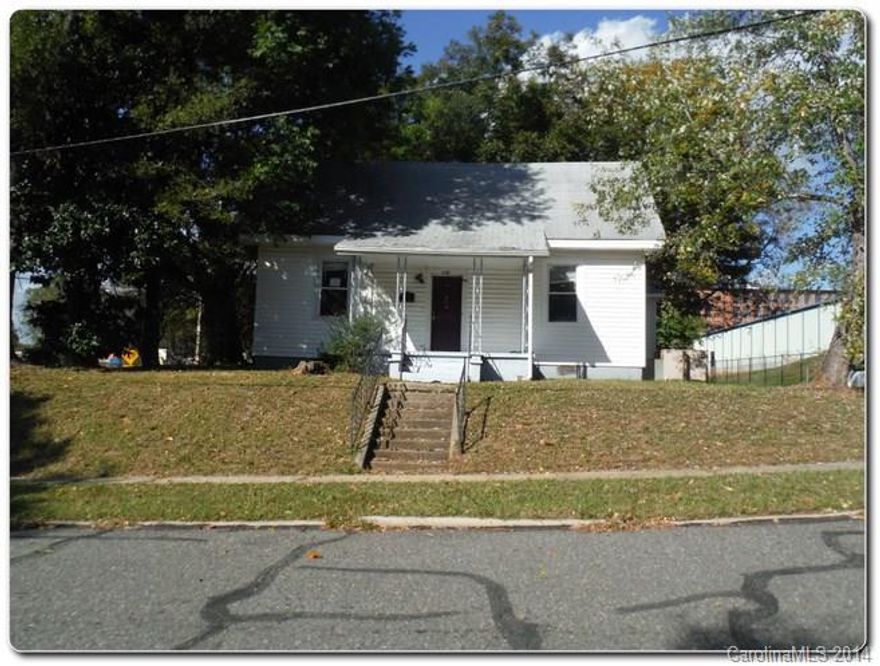 Investor's dream house! Home sits on a large corner lot with inviting porch!
Yard has mature trees that provides shades all year round. 3 bedrooms and 1 bath plus there's bonus room upstairs! Discolorations present inside home.