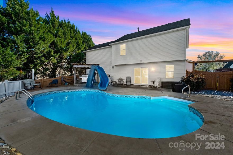 Step into your summer sanctuary! This inviting residence boasts 4 bedrooms and 2.5 bathrooms. Upon entry, a welcoming living room with a cozy gas fireplace awaits to the left, while a dining room sits to the right. The kitchen shines with newly installed white cabinets and luxurious quartz countertops. A convenient half bath with a stylish new vanity adds to the main floor's allure. Outside, enjoy your own private haven with a sparkling SALTWATER IN-GROUND POOL & grassy yard, surrounded by seasonal blooming flowers and verdant plants. The fence has received a fresh coat of paint, and a new shed stands ready to accommodate all your yard essentials. Upstairs, indulge in the comfort of the primary bedroom featuring a generously sized walk-in closet and updated ensuite. Three additional bedrooms, a full bathroom, and laundry facilities complete the upstairs layout, ensuring both functionality and comfort throughout the home. Showings to begin 3/16.