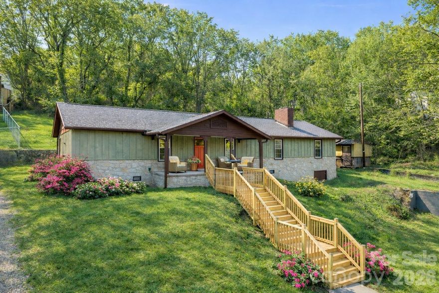 Beautifully renovated single level home combining classic charm with modern updates, set on just under half an acre with scenic mountain views. The wood and stone veneer exterior creates striking curb appeal, complemented by a brand-new wooden staircase leading up from the parking area to a spacious covered front porch, perfect for relaxing and taking in the views.

Inside, the home feels fresh and cohesive with new vinyl windows, updated LED light fixtures throughout, and coffered ceilings in all three bedrooms that add architectural character. The living area features a cozy fireplace with hearth, creating a warm and welcoming focal point. The bright kitchen showcases fresh white cabinetry, butcher block countertops, brand-new stainless steel appliances, and stylish subway tile accents with dark grout that continue into the bath for a unified design.

A large laundry room offers built-in storage for everyday convenience, while the front bedroom includes a generous walk-in closet. Outdoors, the property provides ample space in the rear for a workshop or garden, plus an existing garden shed on the side of the home. Move-in ready with thoughtful updates throughout, this home offers comfort, functionality, and mountain charm in one inviting package. 3 Minutes to Ingles grocery store and Starbucks! 5 Minutes to historic downtown Canton. 24 Minutes to Asheville. 20 Minutes to both Maggie Valley and historic downtown Waynesville. Don't miss the chance to make your dream of mountain living a reality!