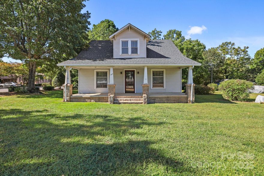 Nestled on nearly half an acre in the charming town of Granite Quarry, this spacious 4 bedroom, 2 bathroom home offers endless potential.  With a bonus room that could easily serve as a 5th bedroom, there's plenty of space to fit your needs.  Inside, you'll find hardwood floors just waiting to be brought back to life, along with appliances, including washer and dryer, already in place.  The kitchen features a large island and there is also a dining room with lovely french doors and so much character.  A large, welcoming front porch provides the perfect spot to relax and enjoy Carolina days.  Bring your vision and make this property shine!  Conveniently located in the East Rowan district, close to dining, shopping, and the Granite Civic Park.  This home is accepting cash or conventional offers only.