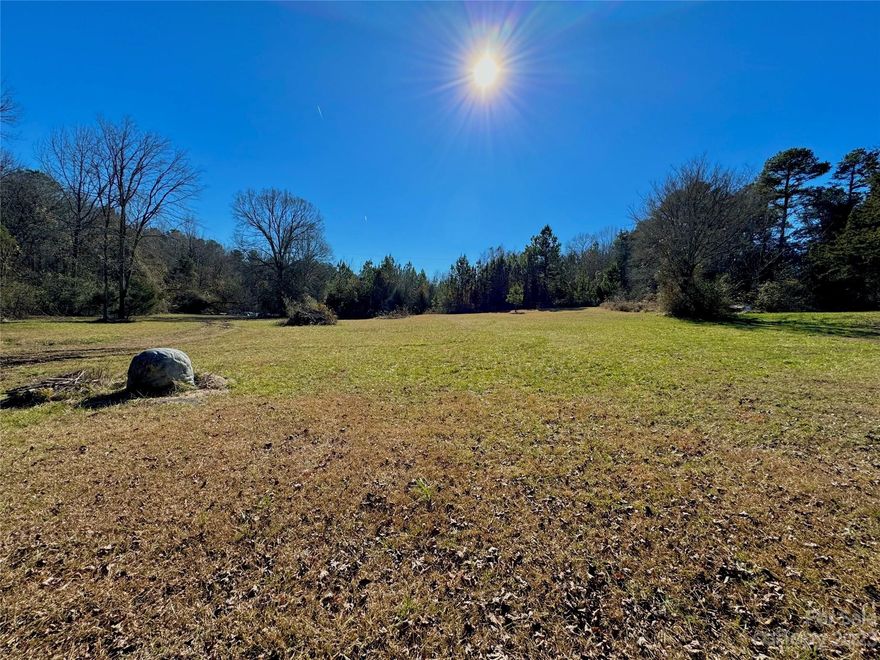 Experience tranquility in Indian Land with this private and serene 1-acre lot located just at the NC/SC line. This lot offers a unique blend of relaxation and convenience. Enjoy the natural beauty with a creek along the property line, free from restrictions. Benefit from an already installed private well, septic permit & survey. Permanent recorded easement provides easy access to property off of Stacy Howie. No HOA, CCR's to contended with. Horse farm at the end of the gravel drive has permanent ingress/egress as per easement, but there is no residence other then the barn and pastures. 2 minutes to Marvin, 5 minutes to Publix in Indian Land but with all the quiet enjoyment you can ask for. The possibility for an additional 3+ acres but would have to purchase together with this lot. Ask for more details. The recorded easement is in the attachments, as is the survey and the septic permit.
