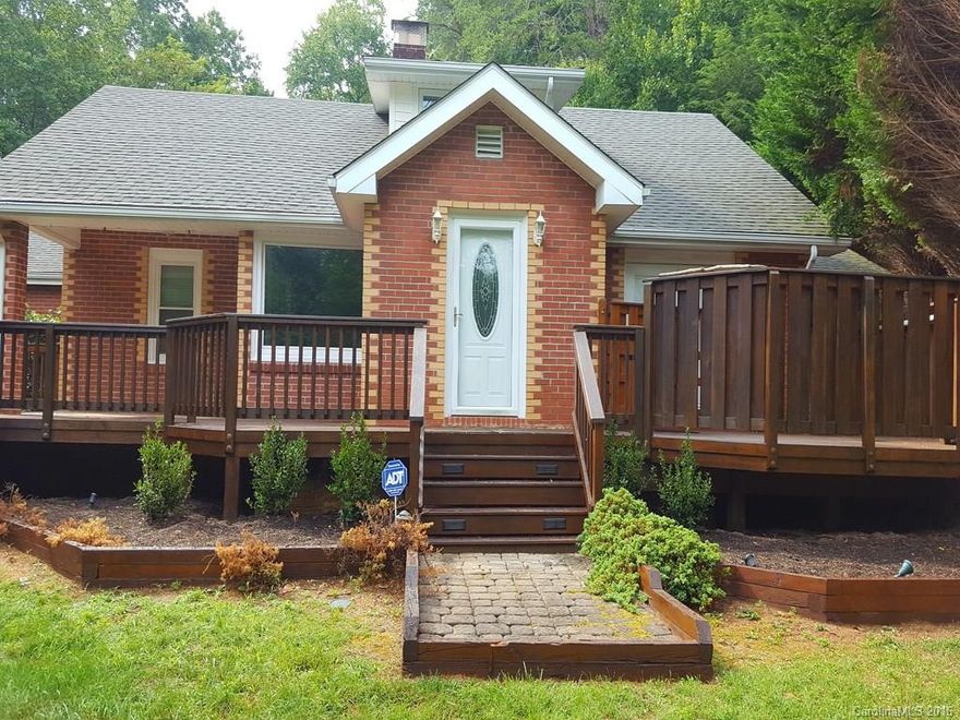 This home is very unique; it has a separate, detached garage, with electric and water, that is 1500 sq.ft with 12 ft ceilings. Great potential for a home based business.  Home has original hardwood floors, very mature landscaping, private backyard, wonderful flow, formal dining room with picture window, fireplace, 2 bonus rooms up can be used as bedrooms, and an entry room that would make a great office. Lovely fenced backyard allows for pets.  Master has french doors leading to private deck.