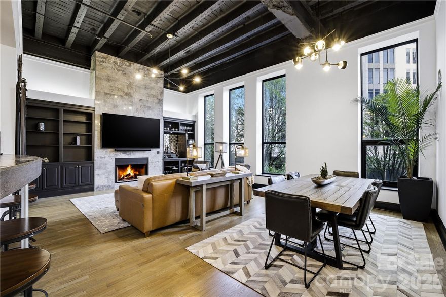 Live elevated in the heart of Uptown Charlotte at The Ivey’s Hotel, an extraordinary opportunity to own a rare luxury residence within one of the city’s most coveted addresses. Historic elegance meets modern industrial sophistication in this refined urban retreat, perched above one of Charlotte’s premier boutique hotels. Set high above the vibrant energy below, the residence offers sweeping skyline views and a peaceful escape in the center of the city. Thoughtfully finished, the home seamlessly blends urban character with refined comfort, creating a space equally suited for everyday living or an upscale lock-and-leave lifestyle. Residents enjoy access to an exceptional suite of experiences and services within this iconic landmark, including 24-hour concierge service and a 24-hour fitness center featuring premium cardio and strength equipment, Peloton options, and dedicated stretching and yoga space just steps from your door. Enjoy exclusive access to Sophia’s Lounge, an award-winning destination for artisanal cocktails and elevated social gatherings, along with the hotel’s stunning Parisian-inspired lobby showcasing curated art and timeless design. Just downstairs, Monarch Market, Uptown’s premier indoor food hall, offers a curated collection of chef-driven dining options, while Church & Union, one of Charlotte’s most sought-after dining destinations, sits directly at your doorstep. Private parking and premium building amenities elevate everyday living into a seamless luxury experience. Whether enjoyed as a primary residence or a sophisticated city retreat, this home delivers an unmatched combination of location, lifestyle, and design offering a truly elevated way to experience Uptown Charlotte.