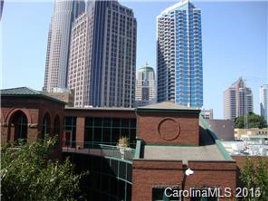 Prestigious 400 North Church! Amazing city views! 2 BR, 2 BA condo with hardwoods in living areas, gas log fireplace, spacious and open split floor plan. Washer/dryer included. Fitness center. Secured building, one parking space in secured garage. Storage unit. One block off of N. Tryon St. Walk to everything!!