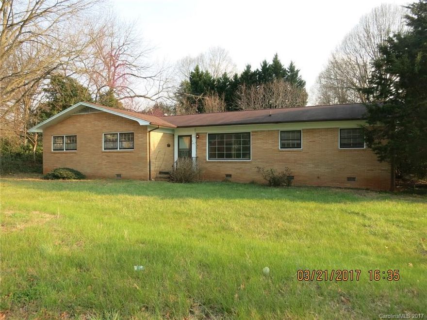 Investors take note of this solid all brick home with 4 BRs, 2 full baths, hardwood and tile floors (no carpets), DBL garage.  Needs renovations and not likely to qualify for financing.