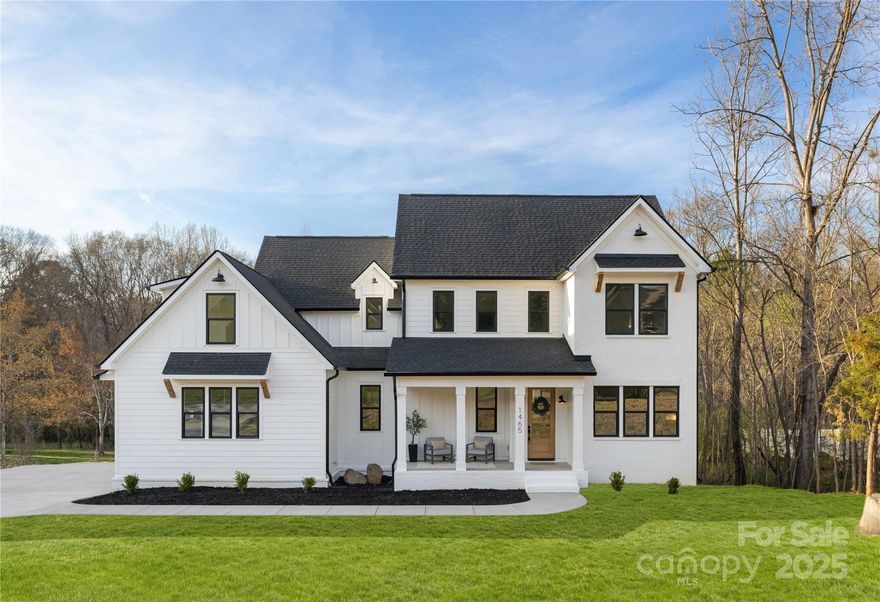 This beautifully crafted transitional farmhouse, completed in 2025, is a true testament to quality and design. Built well beyond standard codes, this home offers superior durability and efficiency. The kitchen is a standout, boasting premium finishes, generous counter space, and ample storage - all harmoniously designed to complement the chandeliers and other finishes throughout the home Large, European-imported energy-efficient windows and a rear accordion door enhance insulation while flooding the home with natural light, creating a bright and welcoming atmosphere. Elegant wood flooring runs throughout, adding warmth and character to every space. Outside, a spacious extra-wide, long driveway offers ample parking, while covered porches (front and rear) provide the perfect setting to relax and enjoy the surroundings. This home is a rare blend of craftsmanship, efficiency, and style—don’t miss the opportunity to make it yours!