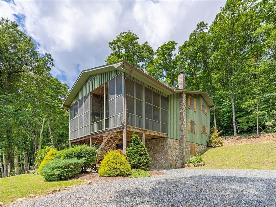 Enjoy the over 20 mile view from a roomy screened front porch attached to a cozy 4/3 mountain home.  Knotted wood, twisted laurel and stone bring the beauty of the outdoors, inside.  Very well built 2500+- two story barn to store all of your equipment and toys.  Combining 2 tracts and 5.84 acres, this high elevation, big view, property offers a highly desired SE to SW exposure within the fabled Plott Balsam Mountain Range.  This offering is located within the Sylva Vista Community consisting of mostly large lots with commanding long range views.  Room for an additional home site on this offering.  This gated and private community is surrounded by the Sylva Watershed, Nature Conservancy and USFS Land.    Seller has several other lots available to combine with this sale if interested.  See MLS 3935940 for the master listing.  Near this property is a 160+- acreage that could also be available with cascading waterfalls, large older forests, rock outcroppings and rare fauna and flora.