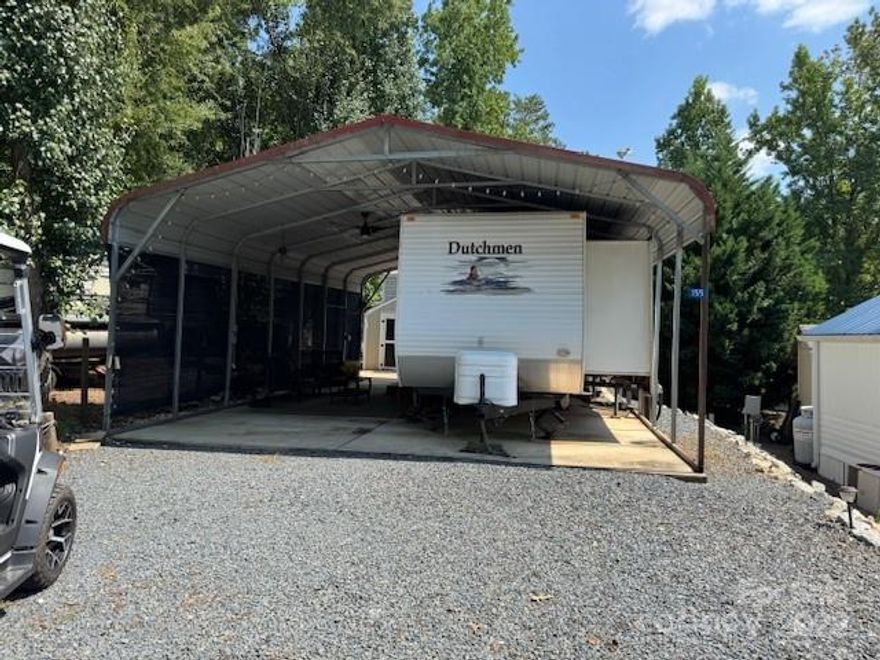 Great new listing on Holly Harbor Trail covered camper with cement slab storage building, furnished, appliances.  This unit is spacious and ready to be used plenty of parking and easy in and easy out location.  Covered for the hot days or the rainy days.