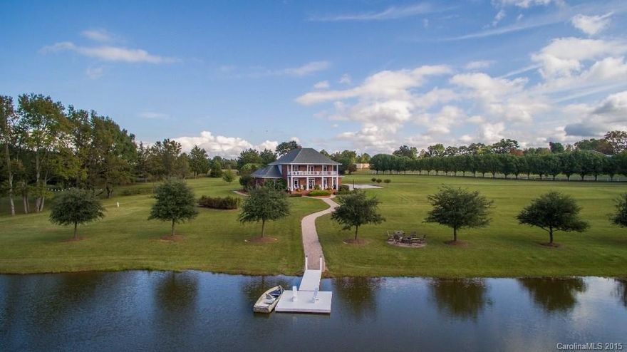 Unbelievable 17.25 acre farm estate is so beautiful you won't know whether you want to keep it all to yourself or share with others to celebrate life events.  Manicured lawns surround 2 acre stocked pond & are boarded by white vinyl fences & trees.  The home is elegant & comfortable. Upgrades/updates include SS appliances, windows, flooring, screened brick porch, generator, 2 wells, paver patios & fire pit, pier & much more. Main floor master suite with office/sitting room. Fenced Pasture & barn