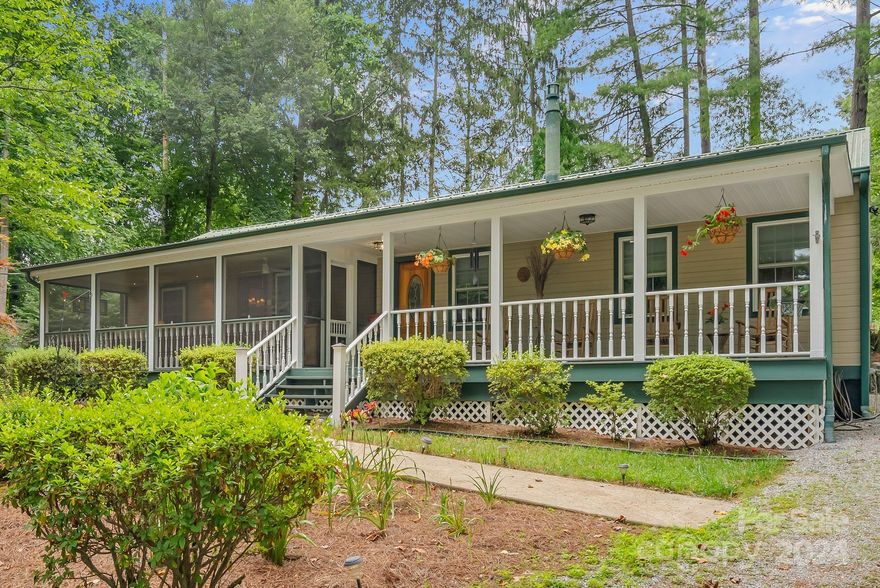 Located less than 2 miles from Main Street, downtown Hendersonville & 1/10 of a mile to the Ecusta Trail connector to Brevard NC.   ONE LEVEL home in a private setting, lovingly cared for at the end of a private road. Various updates in 1999 and 2001.   It boasts an open floor plan, split bedroom plan, 2 primary bedrooms with en suite, 3rd bedroom has full bath steps away.  A bonus room next to a primary suite has been used as TV room, office with computer niche built ins.  Updated kitchen, with ample cabinets opens onto comfy livng and dining areas.  Large kitchen island as well as additional prep areas are suitable for "the chef" and entertainment.  Covered front porch is divided into a screened and open sections.  Both are private and lovely for entertaining or relaxing.  Living area has access to a rear deck area suitable for grilling and outdoor dining.    Quiet setting yet 5 min to all that dtn HVL offers.