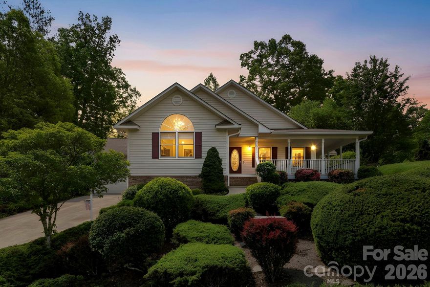 310 Windy Knoll Drive is a well-maintained four-bedroom, three-bath home set within the Mountain Valley community, offered by its original owner and thoughtfully cared for since its construction in 1998.

The main level is designed for everyday living, with all primary spaces—bedrooms, living areas, and kitchen—conveniently arranged on one floor. Hardwood flooring runs throughout, and natural light carries easily from room to room. The living area is anchored by a gas fireplace, while the kitchen offers a functional layout with granite countertops, a gas range, center island, and a casual breakfast nook. A separate family room on the main level provides additional space, equally bright and comfortable.

The lower level is finished with two additional bedrooms, a full bath, and a second living area—well-suited for guests or flexible use—along with a large unfinished section that offers substantial storage.

Set on just over half an acre, the property is defined by mature landscaping, including established azaleas and rhododendrons, and a notably private, level backyard. Outdoor living is supported by both a sun deck and an enclosed four-season room, each positioned to take in the surrounding setting. A detached storage shed adds further utility.

Tucked toward the back of the neighborhood, the home enjoys a quiet, private feel, with glimpses of long-range mountain views. At the same time, convenience remains close at hand. Etowah is just minutes away, offering a full range of daily essentials, including grocery, dining, medical offices, and services.

Positioned between some of the area’s most sought-after destinations, the home is approximately 15 minutes from Downtown Hendersonville, 20 minutes to Brevard, and within 15 minutes of both Pisgah National Forest and DuPont State Recreational Forest. Asheville Regional Airport is also within a 15-minute drive, placing travel and recreation easily within reach.

For golf and recreation, the property is ideally located near Cummings Cove Golf Course and Etowah Valley Country Club.

Utilities include natural gas, city water, community sewer, electric power, and wired internet.

A home that offers a balanced combination of condition, setting, and accessibility—move-in-ready!