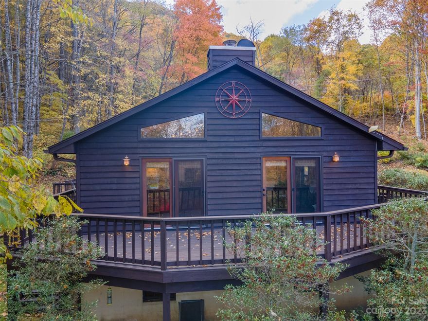 Serenity meets Comfort at this Great Smoky Mountain Home on 3.82 acres. Unique opportunity to live amidst nature's beauty, while enjoying the comforts of modern living. Private views border the National Forest. Step inside to discover a spacious great room w/cathedral ceilings & gleaming hardwood floors. The breakfast bar in the kitchen is perfect for enjoying morning coffee, & central heating & air ensure year-round comfort. Wood Stove for cozy winter nights. The newly finished basement, complete with a bonus room/bedroom or office featuring a potential workshop room adds versatility & extra space for your needs. Entertain on the large deck, relax on the wrap around decks, offering front-row seat to the wildlife. Seclusion, & modern amenities, yet allows you to be in charming downtown Sylva within 15 minutes. Whether you’re looking to have a mountain retreat, rental, or your private homestead, this is the home for you. One hour to all Asheville has to offer & Airport.