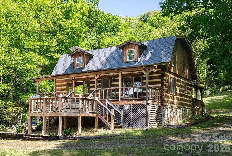 Charming log home, adorned with farm house accents, nestled on 4.3 private acres surrounded by trees. Gaze at the pond and mountain views  from the porch swing or rocking chairs. This is home offers a relaxing pace, a barn for livestock or workshop and an unfinished basement with room for expanding the living space while providing ample storage.  Bring your vision for a perfect mountain getaway, updating it to your preference, this spot is ideal for a vacation retreat or full time residence.