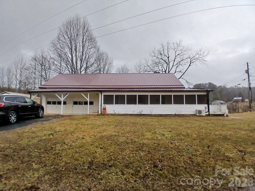 This old house, many updates have been done. You can move right in and just add your own personal touches. New cabinets and counter tops for the kitchen and a new refrigerator. There is a new bathroom upstairs with a washer and dryer but there is also a laundry room off the kitchen downstairs. New windows have been installed, and foundation work is in the process. Metal beams are installed in the crawl space and will be adjusted for the next couple years to help level the floor. The metal roof has new lifetime screws and new flashing. New guttering has been installed.  The hot water heater was replaced in 2024. 
This spacious home has lots to offer and has lots of storage space Nice screened front porch for your sitting pleasure as you enjoy the fresh mountain air and the sounds of nature. There are 2 outbuilding on the property and believe it or not the yard is flat. Come have a look. New grape vines will soon produce plenty of fruit for jelly and juice, and plenty of space for a garden. Easy access to Bakersville and only a short drive to Spruce Pine and Johnson City. And don't forget to visit beautiful Roan Mountain several times a year. Make this home yours today, call for a showing appointment.