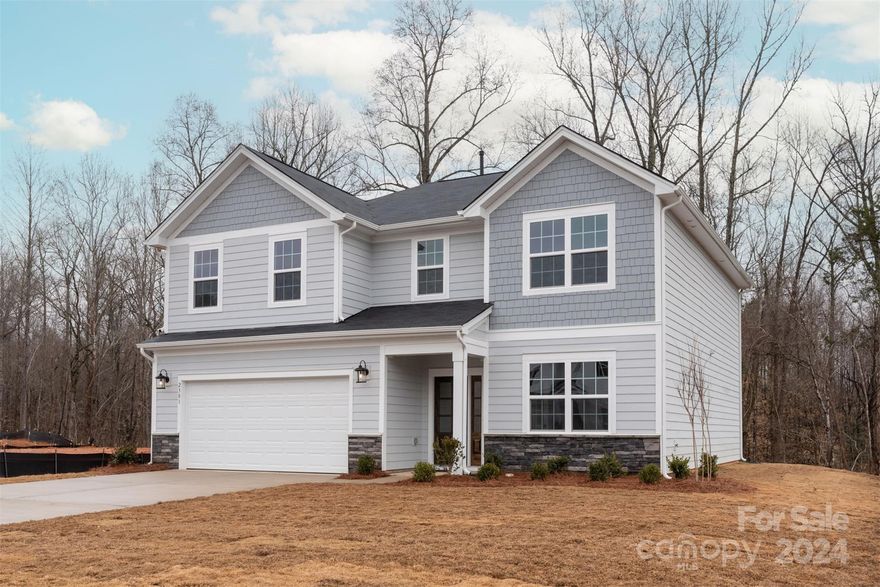 This home backs up to a thick tree-save perimeter surrounding the community & is on the edge of a cul-de-sac. Exterior features painted composite siding, Knotty Alder front door & rear covered porch with a view of the woods. Flex room! KIT w/ white perimeter cabs w/ Harbor Grey cabs at island, quartz counters, GE Cafe SS gas range w/ extraction hood & built-in below-the-counter microwave, trash pullout, large undermount SS sink, mosaic tile backsplash, walk-in pantry. Breakfast rm leads to rear porch, and has a niche to add shelves or storage. Mud drop zone. Upstairs is a spacious loft. Premier Suite has a tray clg & 2 WICs; bath w/ quartz counters, white cabs, large tiled shower, tiled floor. Bath 2 w/ Harbor Gray cabs, quartz counters, steel tub w/ tiled surround, tiled floor. Laundry has tiled floor. Hardwoods throughout entire 1st floor, w/ oak treads on stairs. Future pool & tot lot amenity! 2-1 mortgage rate buydown available from seller when using preferred lender.