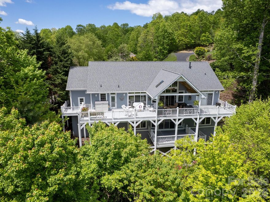 **LAUREL PARK GEM!**This refined ranch offers open layout with highly desired lower level walkout access. First floor showcases beautiful hardwood floors, complemented by newly replaced carpet on stairs and lower level. Convenient first floor primary suite includes door walled access to deck that spans the entire rear of the home. Vaulted ceilings in both Great Rm and DR. Abundant daylight windows, transoms, and door walls seamlessly connects to private outdoor setting. Private and stunning views from rear deck. Notable upgrades include whole house generator, two  zone heating and cooling systems, Aprilair humidifiers 2021. All appliances upgraded and  updated. Home freshly painted inside and out. Complete roof replacement 2022. Please refer to detailed Improvements Attachment. 1.18 acre lot borders protected Conservancy land at rear. Built in speakers in great room and deck. This home is nestled in the mountains for the ultimate retreat home setting. Level walk to front entrance and garage for convenience.   All just waiting for you!