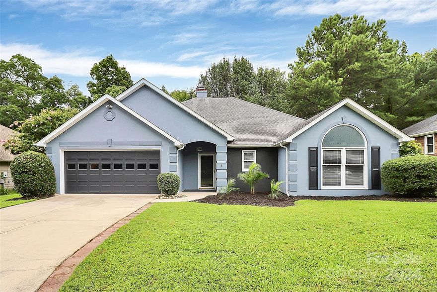 Welcome to this lovely private home on Spinnaker Drive. Large OPEN FLOOR PLAN! Great room is large with inviting fireplace and updated Ceiling fan . The kitchen recently update w/Quartz Counter-tops, Newer SS Appliances,  Designer Cabinets and large eat in area. Split- bedroom plan for privacy. Large master bedroom suite with custom bathroom with a separate shower.   Relax in the large tub while enjoying nature through the picture window. Separate private toilet, update dual vanities and fixtures and a large walk in closet. Guest bathroom had updated vanity and fixtures. Enjoy the outdoors all year long on your Glassed- Screened Covered Porch. Beautiful private deck over looking natural woodlands. Abundant storage space, and low maintenance all on a Quiet Cul-de-sac street! Tega Cay life is wonderful with a Marina, Clubhouse, 7-day a week Restaurant, 27- Hole Golf Course, Tennis Courts, Pickleball Courts, Playgrounds, Swim-Club & Parks galore. The Community is surrounded by Lake Wylie.