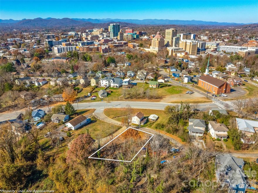A rare opportunity in the heart of Downtown Asheville. This .20-acre, flat, buildable lot offers sweeping mountain vistas and sparkling city skyline views, all within a short stroll to Asheville’s best dining, breweries, galleries, and music venues. With city utilities nearby and flexible building potential, this lot is primed for your modern mountain retreat, luxury investment property, or boutique development with guest house. Enjoy unmatched convenience, sun-soaked exposure, and an address that places you at the center of everything Asheville has to offer.