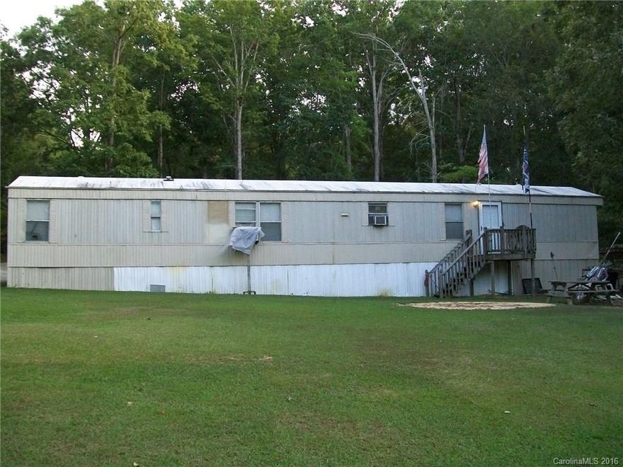 SIt back and watch nature in this 2 Bedroom 2 Bath MH on 3 acres with a creek along the back of property. This home sits off the road on a long private drive.