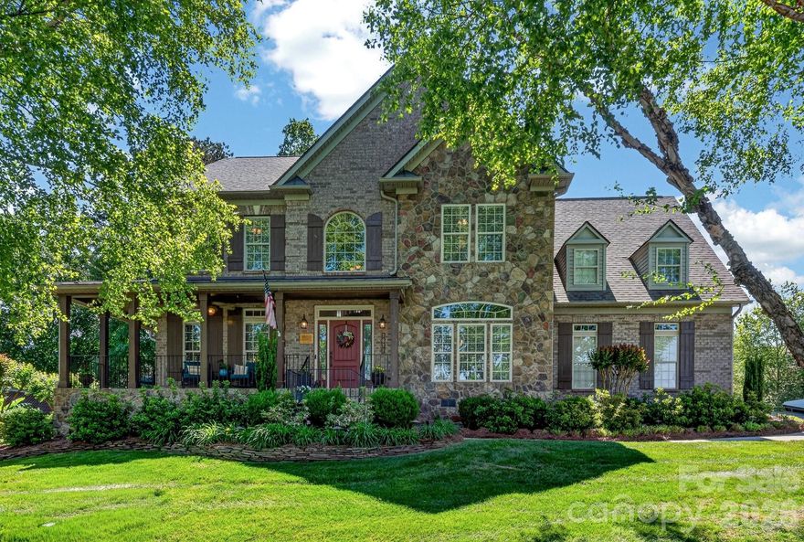 Stately and elegant, this beautifully crafted brick-and-stone home is nestled in a highly desirable community just minutes from shopping, dining, golf, and Lake Norman. The meticulously landscaped yard creates an inviting outdoor oasis—perfect for relaxing on the deck, entertaining on the patio, or gathering around the firepit. There is also a gas hookup for your grill on the deck.

Inside, the home offers 4 spacious bedrooms, 3.5 baths, and a 3-car garage. The warm and inviting family room features a stunning stone fireplace and flows seamlessly into the open-concept kitchen. Designed for both everyday living and entertaining, the chef’s kitchen boasts a gas cooktop, double ovens, a large island, and a bar area ideal for hosting guests.

A versatile main-level office provides the perfect space for working from home, a music room, or a quiet reading retreat.

Upstairs, the luxurious primary suite serves as a private retreat, complemented by generously sized secondary bedrooms. A spacious loft and dedicated media area offer endless possibilities—perfect for homework, crafts, or a second office tucked away from the main living spaces.

Blending comfort, style, and an exceptional location, this home truly has it all.
