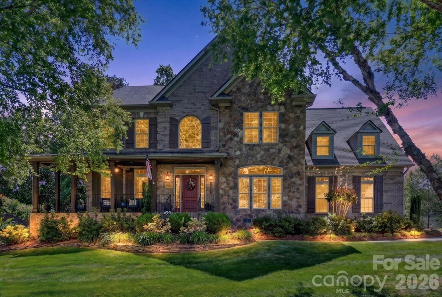 Stately and elegant, this beautifully crafted brick-and-stone home is nestled in a highly desirable community just minutes from shopping, dining, golf, and Lake Norman. The meticulously landscaped yard creates an inviting outdoor oasis—perfect for relaxing on the deck, entertaining on the patio, or gathering around the firepit. There is also a gas hookup for your grill on the deck.

Inside, the home offers 4 spacious bedrooms, 3.5 baths, and a 3-car garage. The warm and inviting family room features a stunning stone fireplace and flows seamlessly into the open-concept kitchen. Designed for both everyday living and entertaining, the chef’s kitchen boasts a gas cooktop, double ovens, a large island, and a bar area ideal for hosting guests.

A versatile main-level office provides the perfect space for working from home, a music room, or a quiet reading retreat.

Upstairs, the luxurious primary suite serves as a private retreat, complemented by generously sized secondary bedrooms. A spacious loft and dedicated media area offer endless possibilities—perfect for homework, crafts, or a second office tucked away from the main living spaces.

Blending comfort, style, and an exceptional location, this home truly has it all.