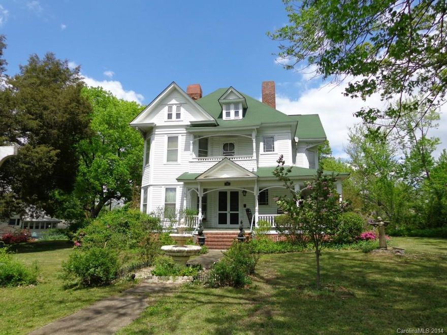 Victorian style 4 bedroom, 2 bath home w/formal living and dining. Partially remodeled w/updated kitchen and baths. Beautiful hardwood floors, walk-thru and bay windows, and stained glass throughout. Custom millwork revealed in the beautiful staircase, fire place mantles, wainscoting, and reed board ceilings. Rocking chair front porch over looks the courtyard-like front yard. Storage building, carport and privacy fenced backyard.