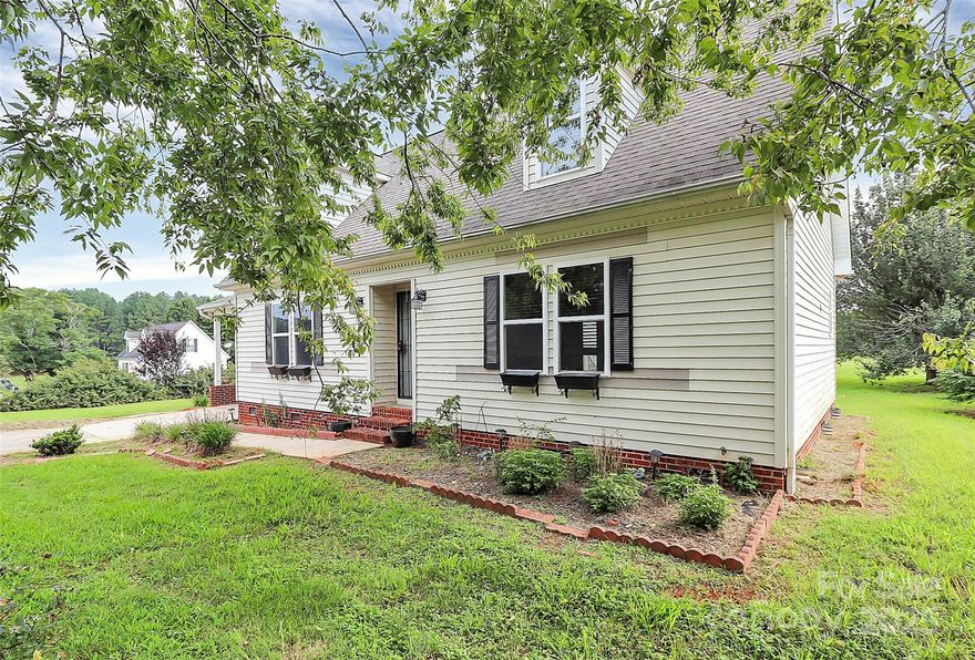 BACK ON THE MARKET THROUGH NO FAULT OF THE SELLER! PRICED TO SELL! Adorable Cape Cod style home situated on a huge, picturesque lot! This charming 2-story home offers 3 bedrooms, 2.5 bathrooms with an inviting open-concept living. The primary suite is conveniently located on the first floor, leading into the recently renovated primary bath. Two additional oversized bedrooms & full bath can be found upstairs, both freshly painted and new flooring installed. The home offers a perfect blend of country charm and modern convenience being only 4 miles from downtown Lincolnton! Step out through the sliding glass doors onto a spacious back deck with a built-in bench, overlooking a 10x10 paver patio and an above-ground pool. The expansive yard is a blank canvas—perfect for gardening, play, or creating your own outdoor oasis. TOO MANY UPDATES TO MENTION, PLEASE SEE FULL ATTACHED FEATURE LIST! MAKE YOUR APPOINTMENT TODAY! Flooring in kitchen, dining room and den are being replaced.
