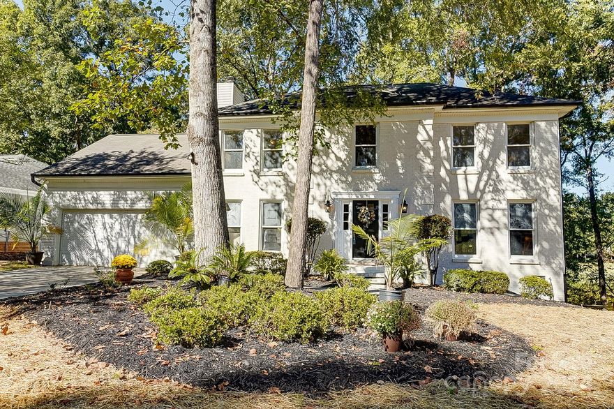 FANTASTIC CUL-DE-SAC LOCATION WITH BEAUTIFUL VIEWS OVERLOOKING THE LAKE AND GOLF COURSE.  Peaceful setting by the lake and 7th green of the Raintree Country Club south course.  Kitchen has newer stainless steel appliances and granite countertops.  Hardwood floors throughout the main level. Great room has a wood burning fireplace with cream painted brick surround. Upstairs are 4 bedrooms and 2 newly updated baths. Brand new deck and freshly painted interior and exterior.  Bonus room over garage is accessible using a 2nd staircase.  Large, wooded yard with irrigation.  Oversized 2 car garage with extra room for storage. Kitchen refrigerator and 2 year old washer and dryer stay with house!!   Property qualifies for waived initiation fee ($30,000) for Raintree Country Club! New windows on order!