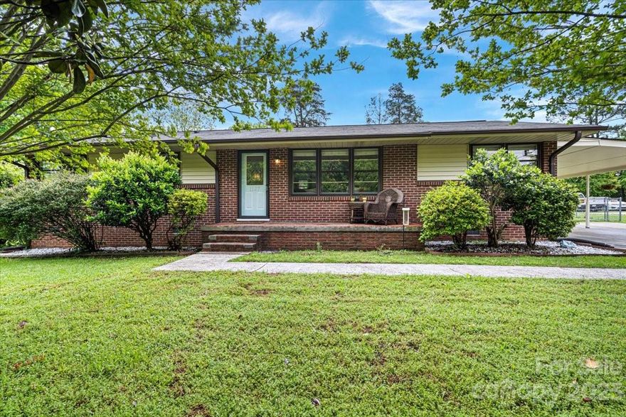 Welcome to your Home Sweet Home on Ogden Rd! This cozy all brick one story home is super cute & cozy. When you walk through the door you'll fall in love with the amazing original hardwood floors throughout the entire home. The living room opens up to the dining room which is perfect for hosting dinners & parties. The kitchen offers lots of extra cabinets & counter space. The oversized laundry room is perfect to store & fold laundry. The fenced in backyard is huge. It's perfect to host the perfect BBQ or let your fur babies to safely play. Multiple cars can park under the carport & the driveway. The beautiful trees in the front yard offer shade during the hot summer days. You will be able to sit on the front porch to enjoy a cup of sweet tea & read your favorite book. Ogden is just minutes from downtown Rock Hill, accessible to major highways, close to shopping, Publix, Food Lion, Walmart, & lots of dining! Schedule your tour TODAY & make Ogden your Home Sweet Home!