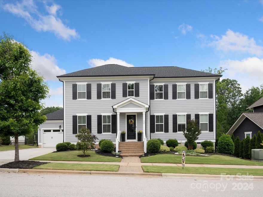 Experience luxury living at its finest in this meticulously designed property. With a custom stack stone fireplace, premium hardwood floors throughout the main level and stairs, and a primary owner's retreat conveniently located on the main floor. Entertainment is elevated with a network and audio video closet, along with ceiling surround sound in the living room. Outside, an extra wide driveway with pavestones adds both convenience and curb appeal. Cat 6 jacks in every room and on exterior for corners for easy security system integration. 8 zone irrigation system for yard and mist connectors for flower beds. 67 ft crawl space for additional storage. Don't miss your opportunity to make this exceptional residence yours.