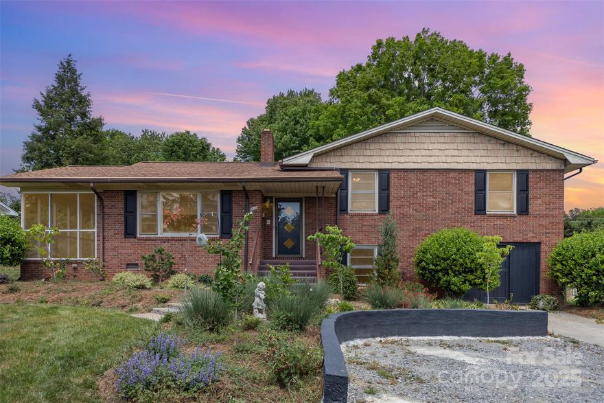 Welcome to this charming home in the heart of Mooresville! This character-filled 3-bedroom, 2- bath brick home is nestled in one of Mooresville's most established and beautiful neighborhoods - just one mile from downtown! Surrounded by mature trees and timeless charm, this home is truly a rare find, offering both an expansive, beautiful backyard and prime location. Inside, you'll find original hardwood floors, showcasing the home's authentic character. This hidden gem blends classic charm with everyday convenience - easy access to I-77, grocery, healthcare, restaurants and shops. 
If you're looking for charm, space, and a great location, this one's a must-see!