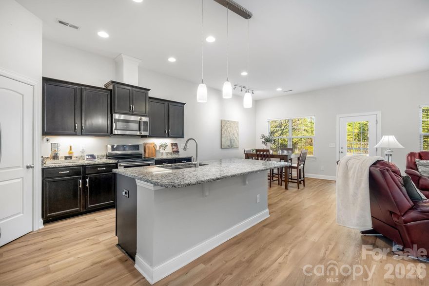 This is a unique floorplan that was upgraded by the sellers to improve the functionality and use of the space. There is brand new LVP flooring throughout the main level of the home. The main level contains 3 spacious bedrooms with 2 full baths, formal living room, open kitchen with dining area and living room. The 4th bedroom is located on the second floor and has it's own small flex space that could be used as a study and a full bath. A great option for multigenerational living. The backyard is fenced and has an extended concrete patio. Lush mature trees line the back of the property. 

The low HOA allows you to select the amenities that fit your family's lifestyle by joining the Palisades Country Club. Enjoy the exclusive Niklaus designed 18-hole golf course, the multi discipline sports complex that include: pickleball, tennis, yoga area, fitness room and a beautiful swim area perfect for all ages. 
Located in a prime location that allows you to enjoy the many surrounding areas within minutes, Lake Wylie, Tega Cay & Fort Mill are only minutes away. Shopping, restaurants, grocery stores are all within minutes. 

Thank you for understanding.