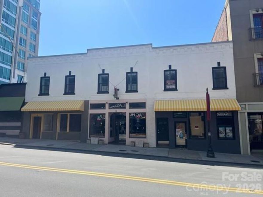 Fully leased, mixed-use historic asset located in the heart of downtown Asheville, NC, offering a stabilized and diversified income stream. Positioned steps away from Pack Square in between the AC Marriott and The Kimpton Arras Hotel.  Built in 1920 and updated in 2024, the property at 9–13 Broadway Street features three ground-level retail spaces, including a restaurant, and two fully furnished residential units (1BR/1.5BA and 1BR/1BA). The asset is 100% occupied with stable tenants and renewal options in place, providing predictable cash flow and long-term income security. Positioned in Asheville’s high-traffic, tourism-driven urban core and surrounded by strong hospitality and retail development, this investment offers multiple revenue streams and a balanced income profile in the heart of downtown Asheville. (Sale includes 2 buildings: PIN 13 Broadway - 
964940261500000 and PIN 9 Broadway - 964940261200000. (No showings until after April 13th)