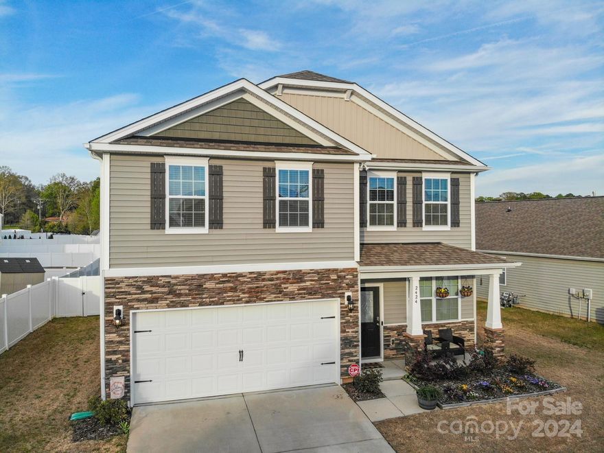 Welcome home to 2424 Tallet Trace! This location near Riverbend Village & Mountain Island Lake (but also a quick drive to Uptown Charlotte!) places you within a path of ideal convenience. Built in a desirable section of Sutton Farms- the neighborhood entrance, community pool & overflow parking are just around the corner. Step into a tasteful show home upon entering from the covered front porch. A large, bright living room w/ fireplace greets you, followed by an intimate dining room. The spacious kitchen has a gas range, lots of cabinets and countertop space and ample room for a breakfast area opening to the large fenced backyard w/ oversized patio. Upstairs are three secondary bedrooms, a full bath, the primary bedroom/bath at the front of the home & laundry centrally located between them all. 2-car garage w/ shelving for additional storage, manicured landscaping, great utility efficiency and more. This one-owner home is immaculate, still feels new and is ready for its next story!