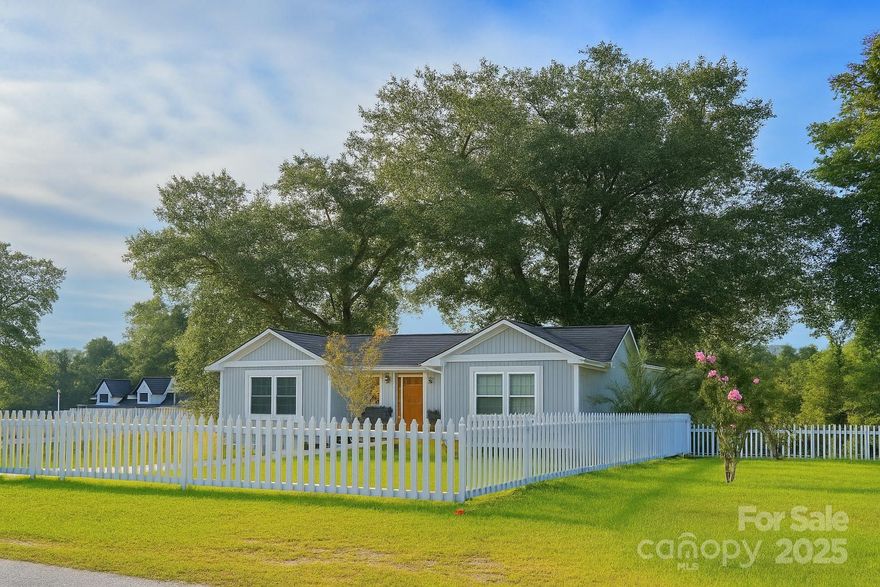 Welcome to this charming 3-bedroom, 2.5-bath home nestled on 1 acre in the peaceful countryside, just 5 minutes from town. Fully renovated in 2021, this home combines modern comfort with classic appeal. Inside, you’ll find a spacious primary suite and two additional bedrooms with a convenient Jack-and-Jill style bathroom. The open layout provides a warm and inviting atmosphere, and all appliances convey—making it truly move-in ready. Step outside to enjoy a large back deck perfect for entertaining, a picket-fenced front yard, and a fenced backyard. A storage building is also included, giving you extra space for tools, hobbies, or outdoor equipment.