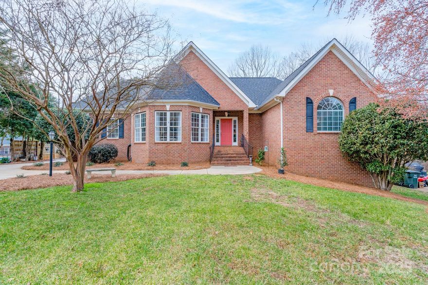 This custom all-brick home is a rare find! The main floor features beautiful hardwood floors, a chef's kitchen (with double ovens, island, butler's pantry, and breakfast area), family room with fireplace, grand dining room, expansive primary suite, and office/library with custom built-ins. A whole new world awaits in the finished basement area with three graciously sized bedrooms, two bathrooms, a rec room/den with fireplace, flex space, and laundry room.  The potential in this home is unlimited! Outdoor living takes on new meaning with the screened-in porch and deck on the main level and a covered porch on the lower level. The oversized two-car garage provides fabulous space for your vehicles and additional storage.  As an added bonus, there is a storage room with an exterior entrance on the basement level and a new roof has been installed in 2025. New gutters will be installed before closing. You do not want to miss the opportunity to check out the character and charm of this home.