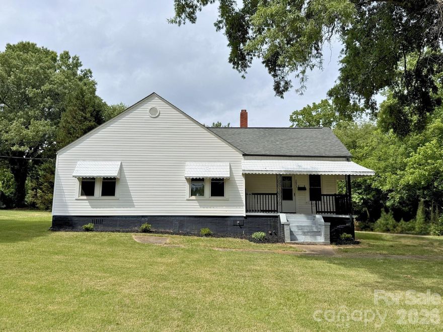 Welcome to this spacious 3-bedroom, 1-bath home featuring low-maintenance vinyl siding and an ideal layout with room for everyone and located just outside the city limits. 

Inside, you'll find both a living room with fireplace and a cozy den, providing flexible spaces for relaxing or entertaining. The home also features a dedicated dining room plus an eat-in kitchen area, giving you multiple options for meals and gatherings.

Enjoy the charm of hardwood flooring paired with durable LVP in select areas, along with fresh paint throughout that makes this home feel move-in ready. With its generous floor plan and thoughtfully designed spaces, there is plenty of room to spread out and make this home your own.