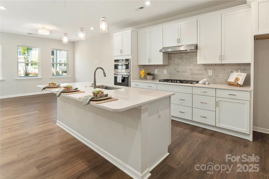 Aggressively priced to sell, a rare FOUR-bedroom townhome in the beautiful Forest Lake community off the Brawley School Peninsula.  The upgraded kitchen features a 5-burner gas cooktop, wall oven/microwave combo, tons of cabinets, large island with plenty of seating and a large pantry. Stylish wide-plank LVP flooring flows throughout the main level. Upstairs, you’ll find FOUR spacious bedrooms! The primary suite includes a huge closet with direct, convenient access to the laundry room. Double vanities add a touch of luxury. Warm, neutral, timeless finishes throughout this lovely home.  Out back, enjoy private, peaceful views of the pond in a quiet location on this premium lot.  Close to Woodland Heights Elementary and Middle Schools, fantastic shopping and dining, and minutes to I-77. Plus, stroll to the community’s cozy common area with firepits, benches, and cornhole! This one checks all the boxes.  Must see to appreciate!