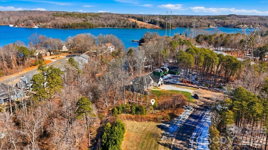 Fantastic opportunity to build your custom home and enjoy the best of Lake Wylie living! This half-acre waterfront homesite is tucked away on a quiet cul-de-sac and gently slopes from the road down to the lake, offering direct access for launching kayaks or paddleboards (non-dockable lot). Located in the peaceful Lake Crest community, residents enjoy a pool, cabana, playground, sidewalks, and a 33-acre nature preserve with walking trails. Experience serene lake life while remaining just minutes from shopping, dining, and everyday conveniences. Additional photographs will be updated this week. Water, sewer, natural gas, cable, and internet available.  This is a great basement lot.  Previous owner shared their building plans and received permission from HOA to build a kayak/canoe storage waterside.