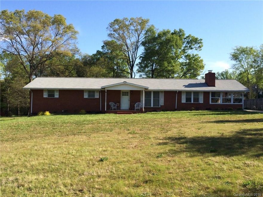 Country living on 4 acres! This is a 4BR/2BT  brick ranch with a 3 car carport. It has a front porch ready for your rockers and a glass side porch. There is also a small house with 2BR/1BT on the property. Currently it has renters who will be moving out in June. This extra house could be great for older parents, other family, or renters. There is also a large 40x60 storage building, a barn, and a field for a garden. All that is missing is you! Check it out today.
