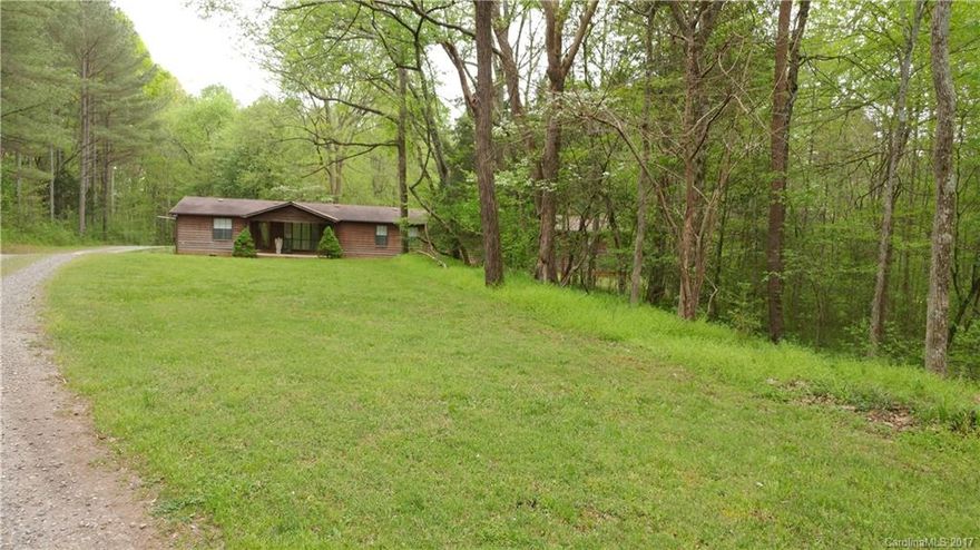 Price reduced, Needs work, owner unable to maintain. Open floor plan, huge garage, sunroom with jacuzzi, nestled on 2.46 wooded acres with long  private drive. Cozy family room off kitchen with stone gas FP, large kitchen with tons of cabinets and pantry, 2.5 baths and spacious bedrooms all offering walk in closets. Master fits king size bed easily. Owner states original roof and systems, no known issues with septic or HVAC system, on community well. Can go FHA w structural inspection