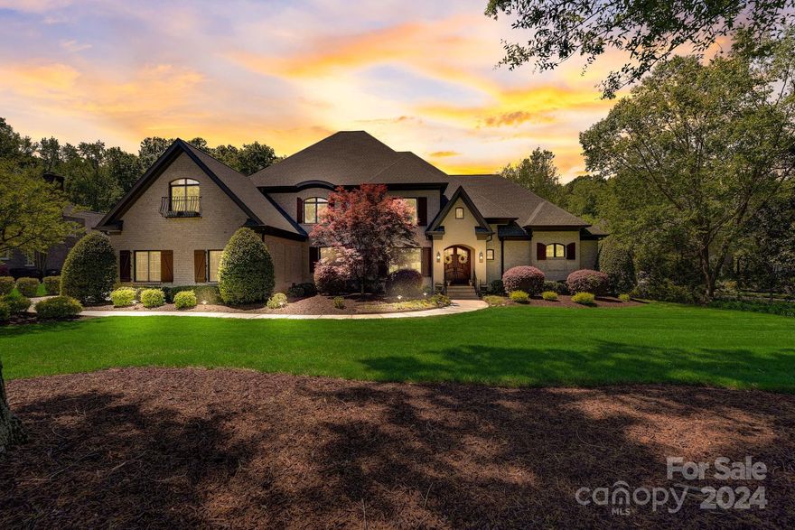 Absolutely gorgeous 5BR 4BTH 2HB POOL home in gated, upscale Providence Downs! One of the best lots on quiet, low traffic street.Tons of updates & improvements.All new lighting,inside & out.Hard to find owner's suite & guest suite on main.2023 kitchen remodel-new KitchenAid stainless appliances with gas cooktop, quartz tops & backsplash.Lrg walk in pantry. Kitchen opens to lovely keeping room w/stacked stone fireplace & vaulted ceiling. Great room has coffered ceiling & another stacked stone fireplace.Huge owner's suite w/ dual closets.2024 owner's bath has new tile, stylish "Autumn Gold" fixtures, lighting & lrg soaking tub.Huge walkin shower.Spacious guest on main w/ensuite bath. Upstairs is a real treat too.There are 3 more spacious bedrooms, a bonus room that could be a 6th BR & huge media rm w/ bar area.Lots of walk in storage.Screened porch overlooks lush fenced yard & pool installed in 2018 with firebowls,spa & firepit area.Wired dollhouse.2023 Roof.2017 HVAC's. Marvin schools!