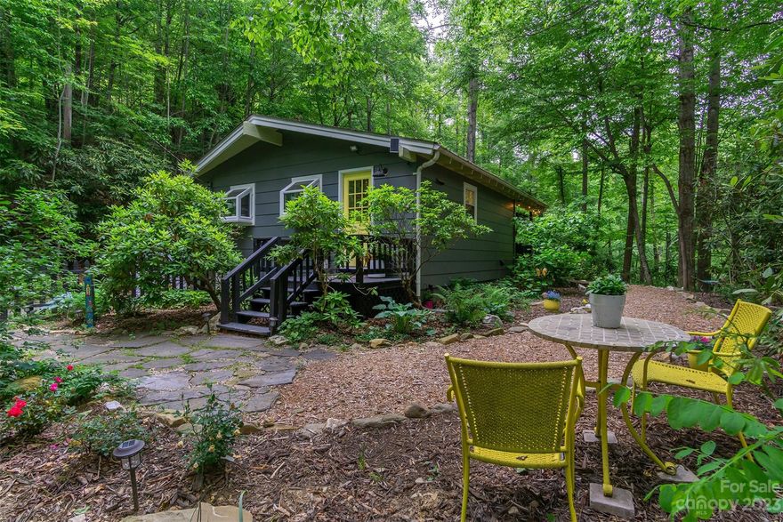 This is the private mountain cabin you have been waiting for! Don't miss out on this beautiful and well maintained home that has everything you need. The home has been completely updated with new windows, water heater, water pressure tank, UV water filter system, interior and exterior paint, doors, septic, and much more! It is open, spacious, light filled with beautiful high ceilings and wood flooring. Come enjoy all the great outdoor space, including a small yard, perennials, decks, and covered carport that is being used as outdoor living space.  It's just minutes from Downtown Black Mountain were you can shop, hike or enjoy one of the many local restaurants. It sits on Continental Divide at 3,000 Ft. of elevation and has a refreshing cool breeze during the summer and a cozy fireplace for cold mountain nights. Short-term rentals allowed. Currently a very successful Airbnb, check it out! Great reviews and income.