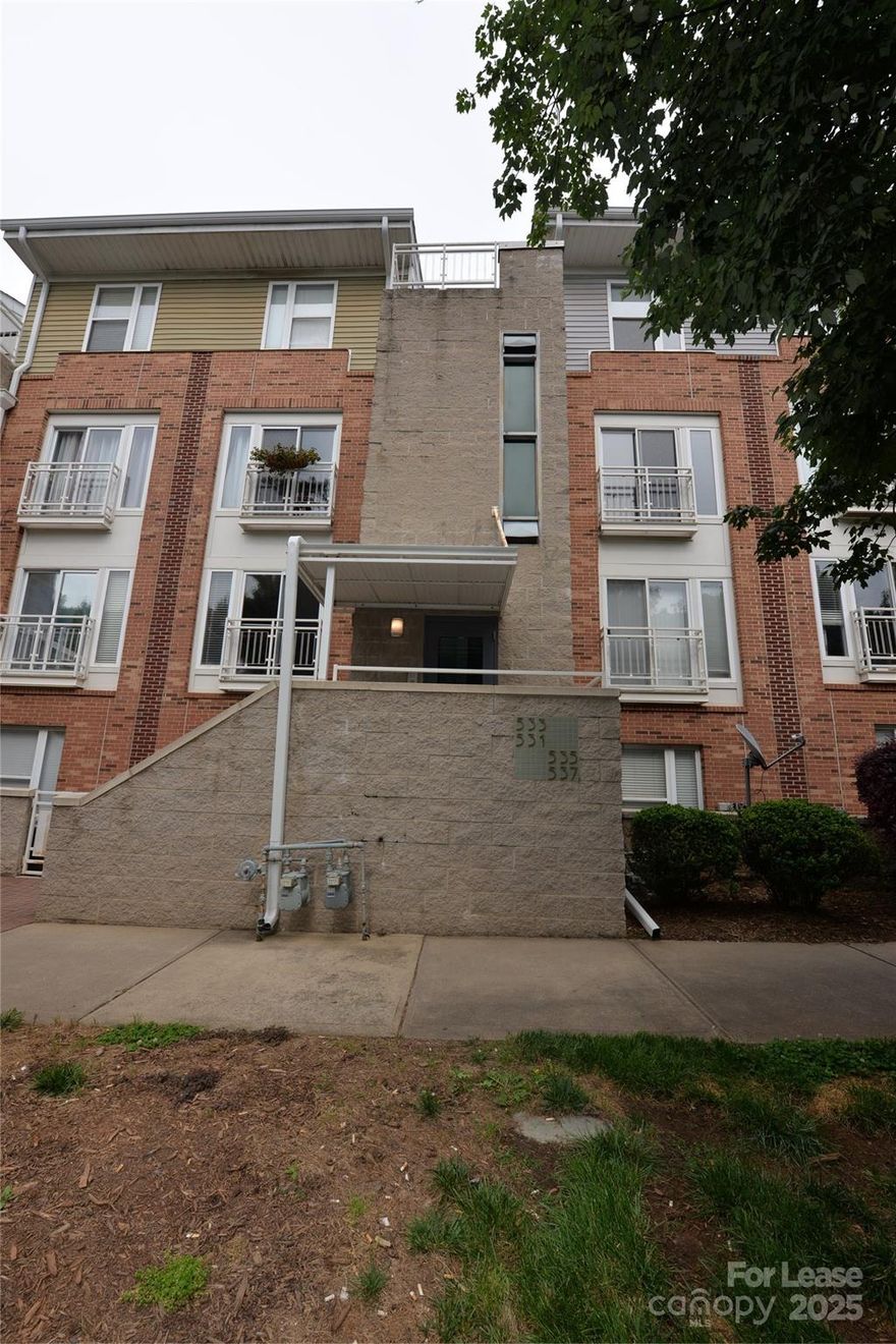 NoDa neighborhood! This beautifully updated 2-bedroom, 2-bathroom condo offers modern living in one of the city's most sought-after areas. GREAT ROOMMATE LAYOUT.  With its open layout, the space feels bright and airy, enhanced by an abundance of natural light and a cozy fireplace perfect for relaxing evenings. The kitchen features stainless-steel appliances, washer and dryer are included. Enjoy the community pool on warm days or take a short stroll to discover NoDa’s trendiest restaurants, unique boutiques, and vibrant entertainment venues. Conveniently located near the Blue Line 36th Street Station,