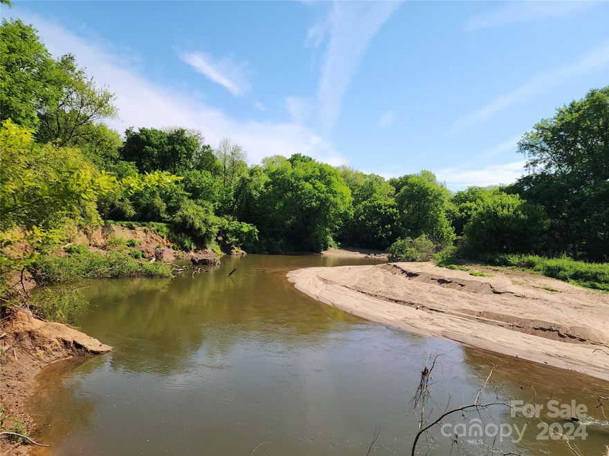 46.5+/- prime development acres in 6 parcels just off the Fort Mill bypass zoned RMX-10 to allow many different types of housing to include single family, cluster subdivisions and conditionally duplex, triplex and quadplexes or build your own family compound. These parcels are just a short distance from the excellent Fort Mill Elementary & Middle schools along with Nations Ford High School and currently has a 1780 +/- square foot 3 BR 2.5 bath single family home being sold in "as is" condition nestled in the woods. Water and sewer for development is conditionally available depending on building density and flow rates needed. Approximately 23 acres is out of the floodplain and 24 +/- lies in the floodplain and backs up to Steele Creek and Sugar Creek with predominantly hardwood trees for a fantastic and private natural area. A contiguous 2.5 +/- acre parcel potentially can be included to increase the width and density potential and other parcels may also be available.